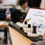 Close-up of gears demonstrating energy and power concepts in an educational setting.