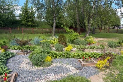 A beautiful spring garden featuring diverse plants and colorful flowers, perfect for relaxation and nature enthusiasts.